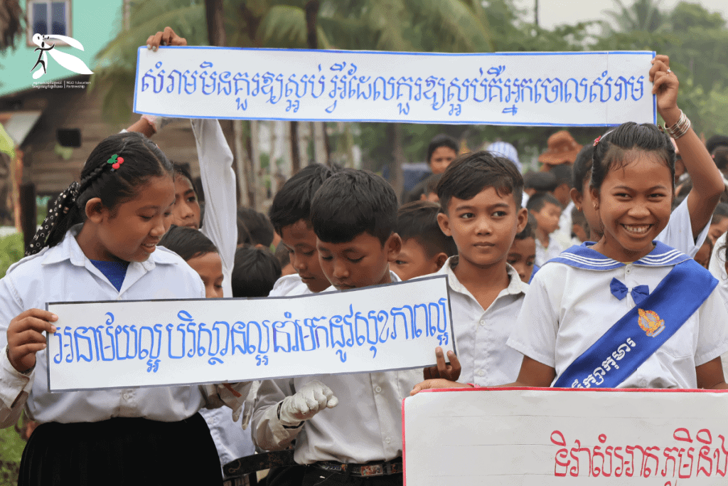 TDSO Students holding banners at educational rally in Cambodia.