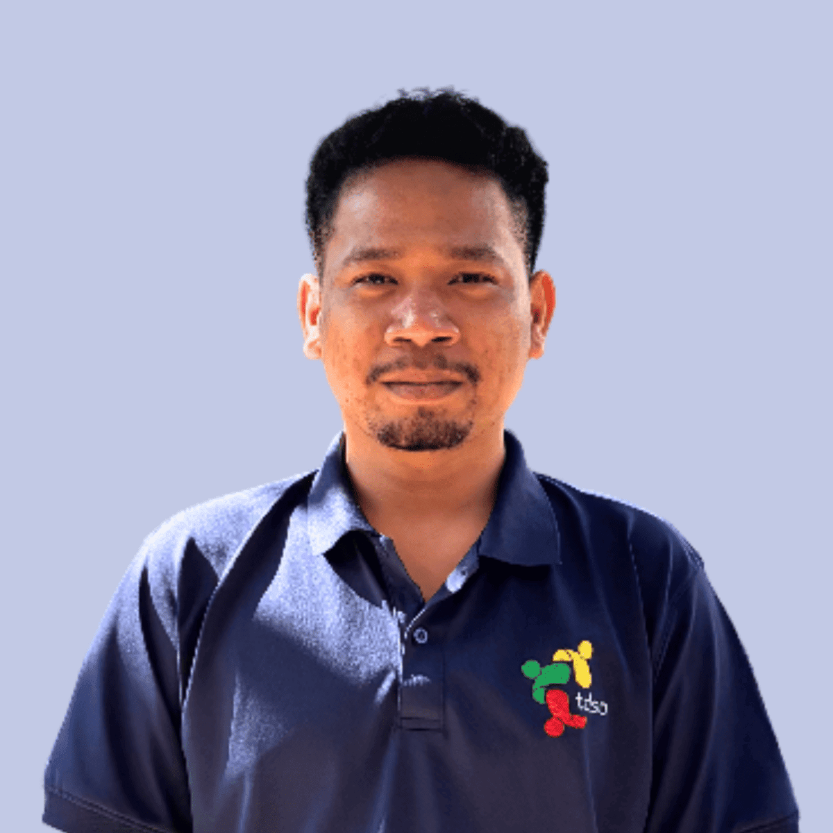 Professional teacher support team member at TDSO in a blue polo shirt.